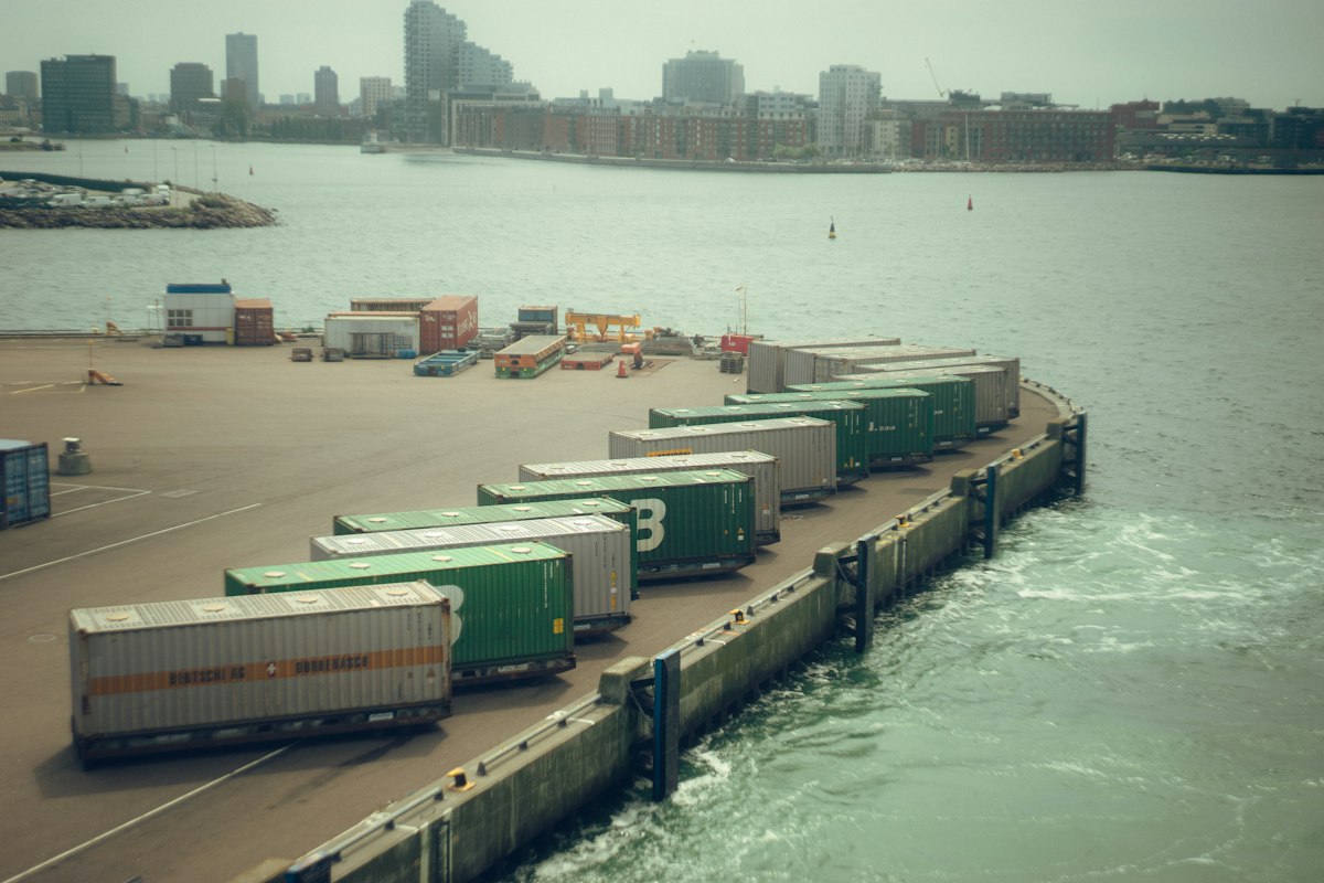 Shipping containers lined up in a port. Reference photograph illustrating trade, not an Afreximbank-financed project.