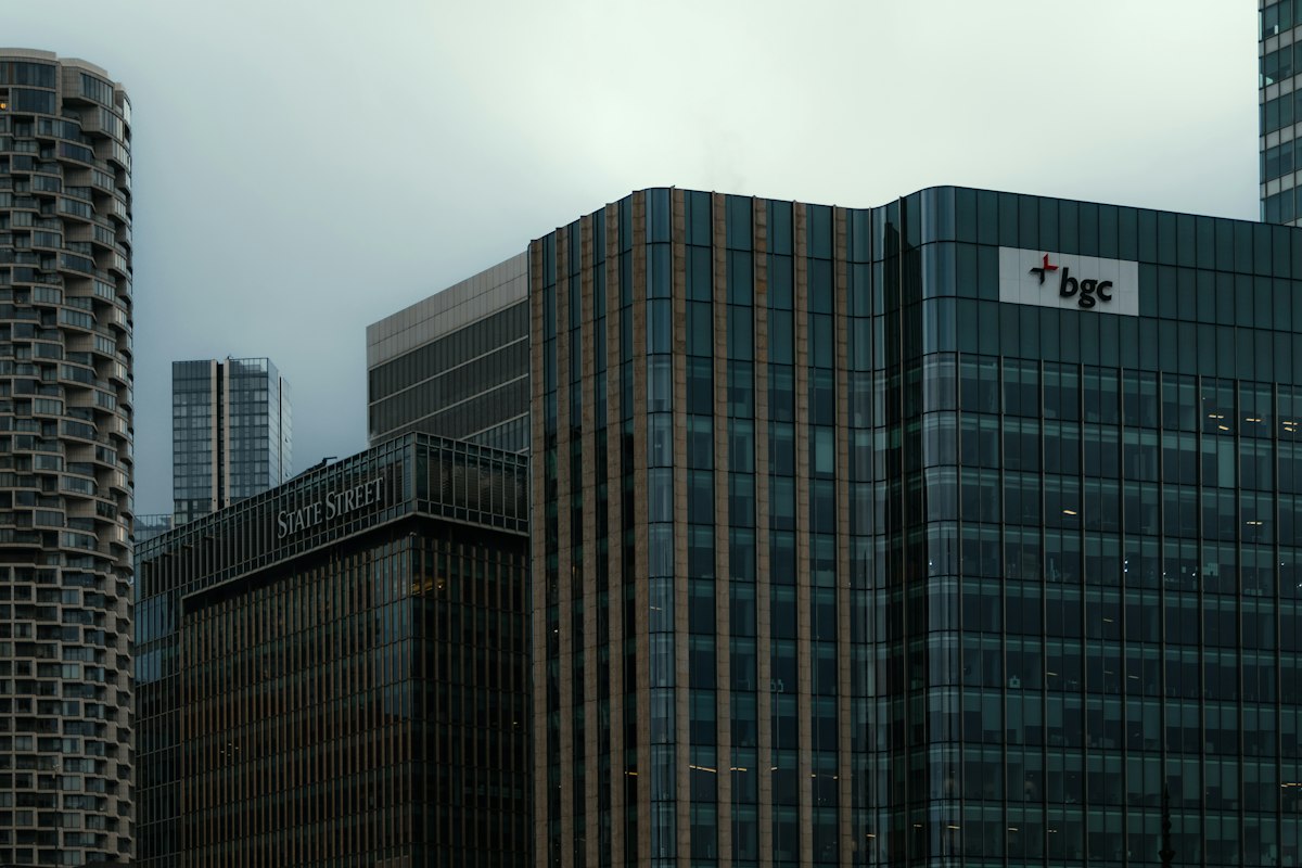 Glass office buildings in London's Canary Wharf financial district. Reference photograph illustrating international finance.