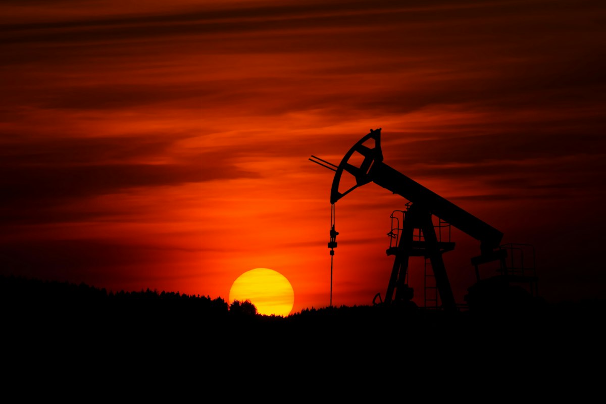 Reference photo: a crude-oil pumpjack silhouetted against the sunset; not a photograph of an OPEC+ meeting or announced output.